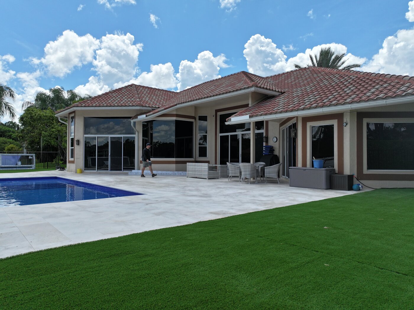 South Florida home with beautiful completed roof and tropical landscaping