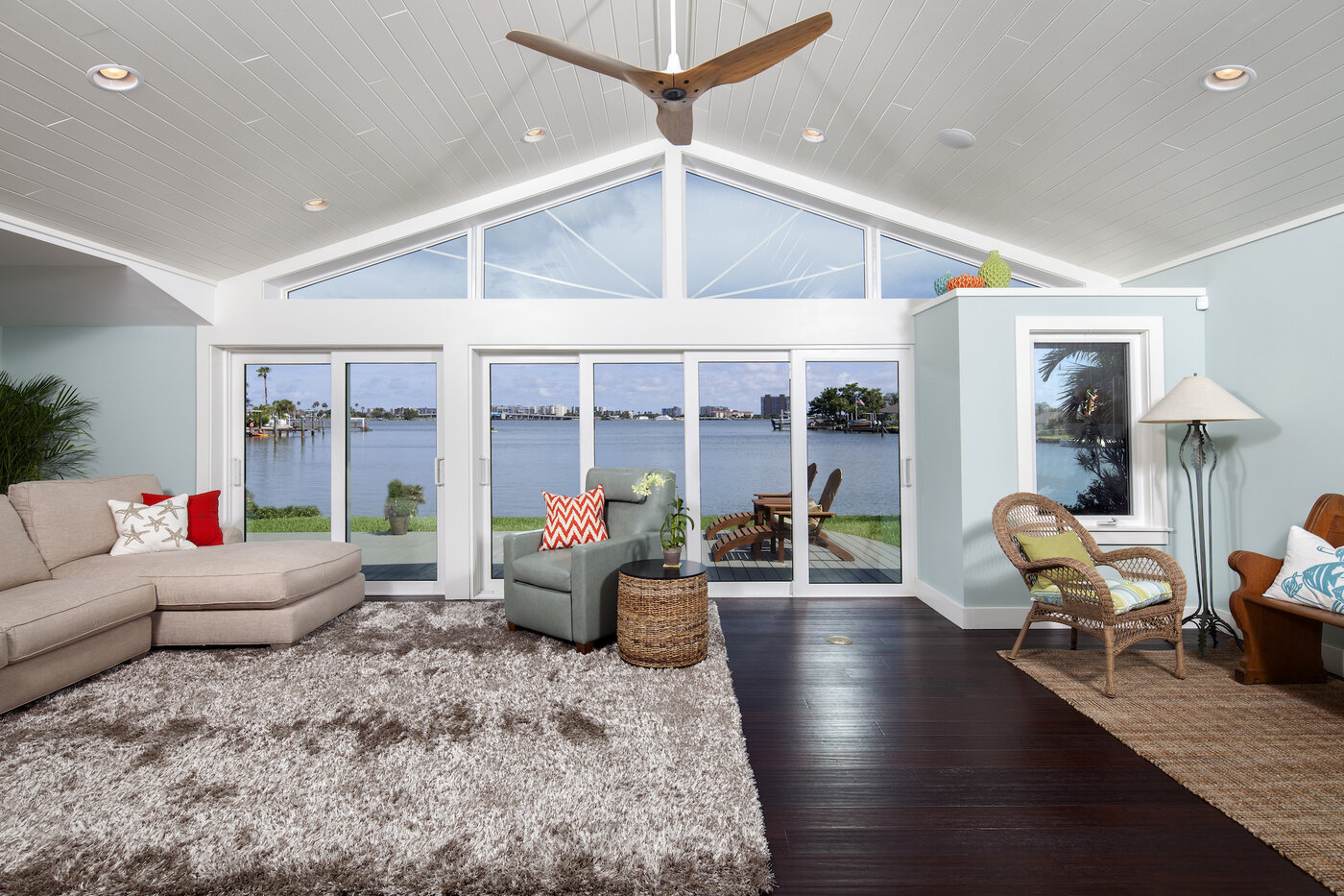 Modern Florida home entrance with impact door and palm trees
