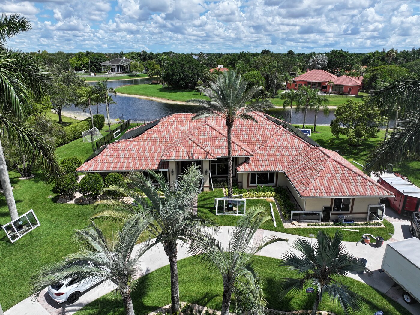 South Florida home exterior with impact windows and tropical landscaping